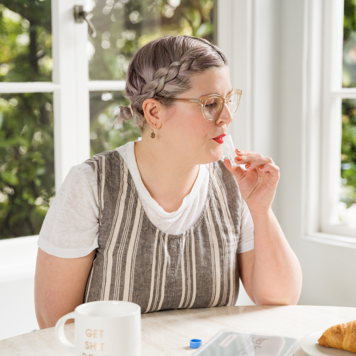 Woman Collecting Saliva in Test Tube up to Required Level.