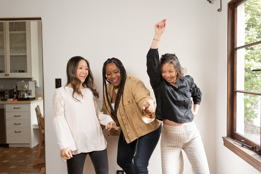 Three Ecstatic Female Friends Celebrating Together.