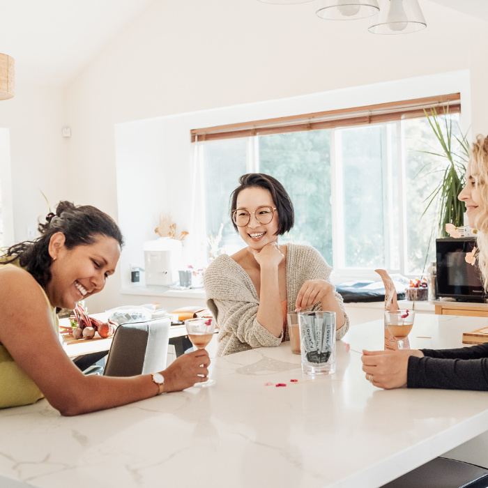 Group of diverse women enjoying Quench, an optimal hydration powder with balanced electrolytes and Astaxanthin